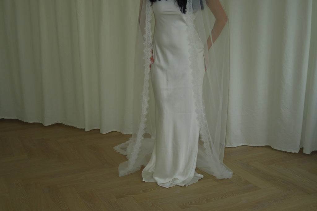 Single-tier vintage lace trim cathedral veil with a soft, cloak-like fall in lightweight tulle — romantic and ethereal bridal design.