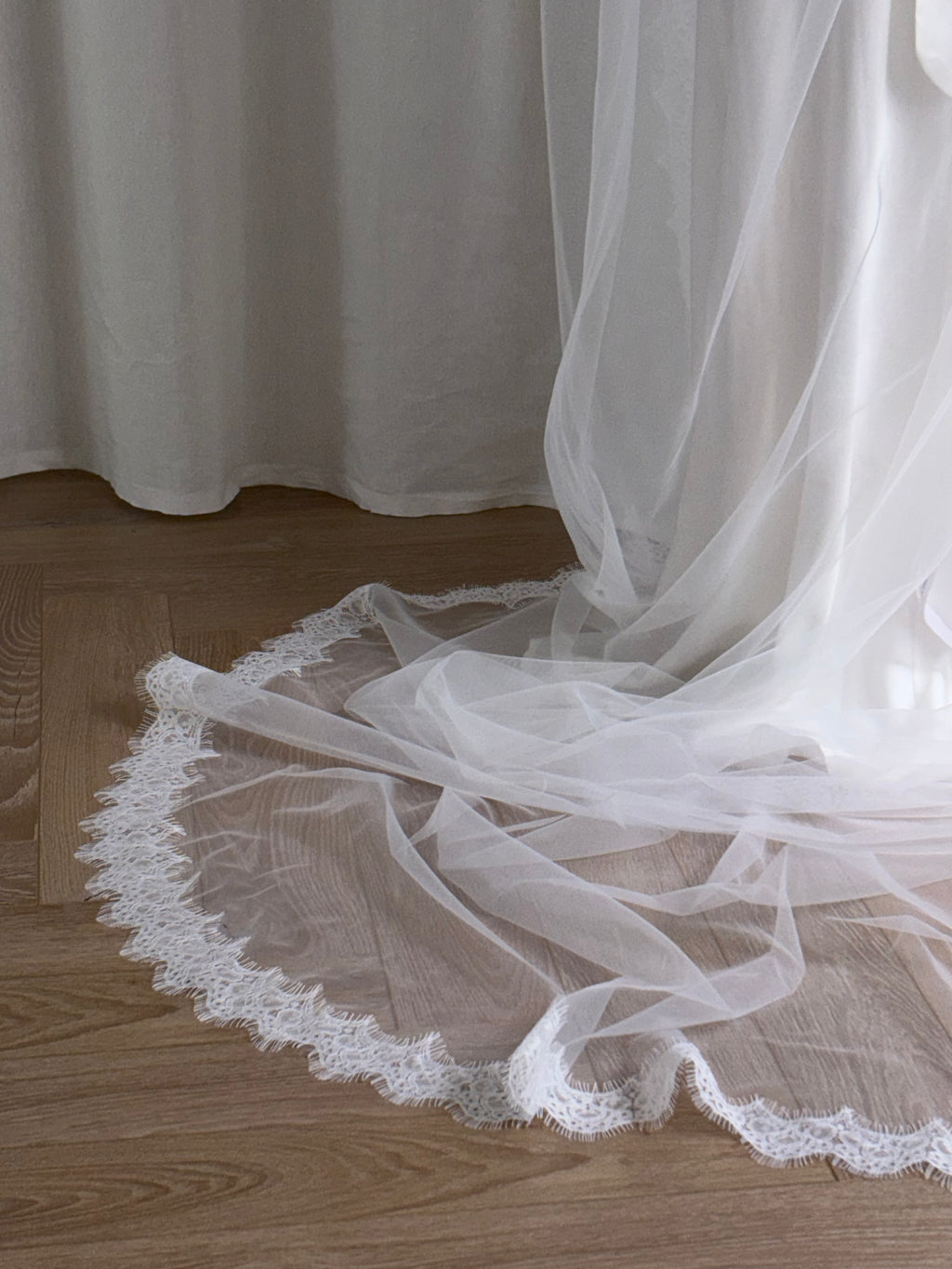 Single-tier vintage lace trim cathedral veil with a soft, cloak-like fall in lightweight tulle — romantic and ethereal bridal design.