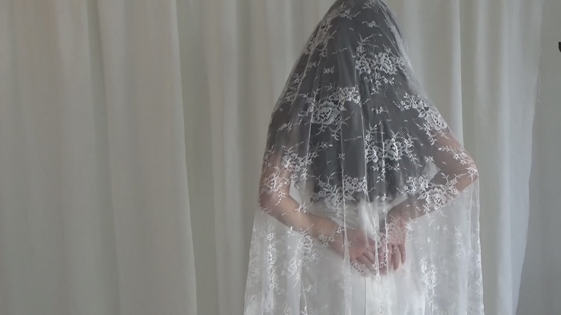 The Mantilla-Style Chantilly Rose Full Lace Veil is a cathedral-length bridal statement piece, designed for timeless elegance. Made from soft, lightweight tulle, it features intricate Chantilly rose lace that frames the veil completely, creating a delicate, romantic finish. The veil drapes beautifully straight to the ground, evoking a graceful, ethereal silhouette.This a vintage take on spanish style mantilla veil.