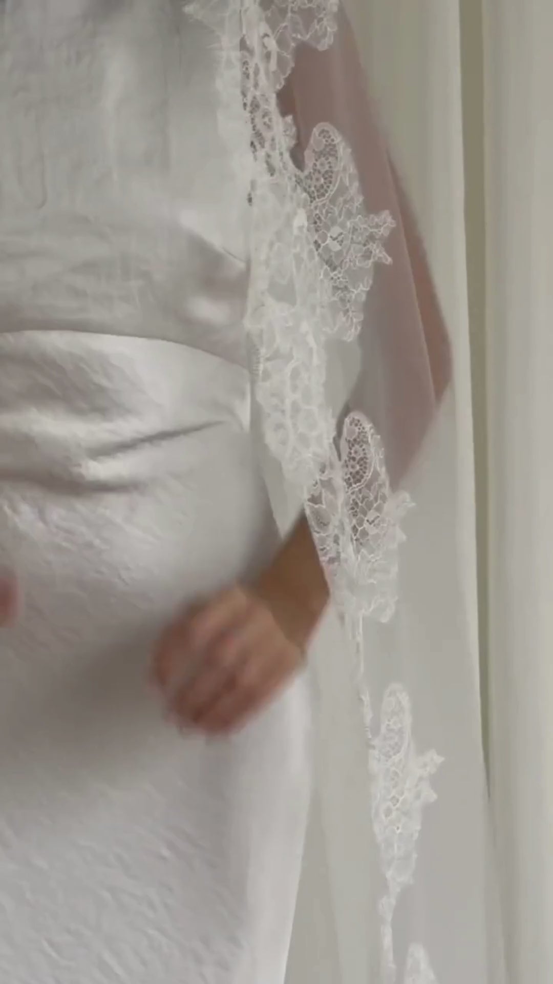 Cathedral-length wedding veil crafted from soft off-white tulle with an intricate Chantilly lace trim, ideal for brides wanting a romantic, elegant bridal accessory